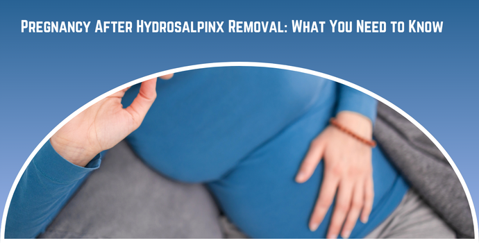 Pregnancy after Hydrosalpinx Removal: What You Need to Know — pregnant person in blue resting a hand on the belly beneath a curved arc.