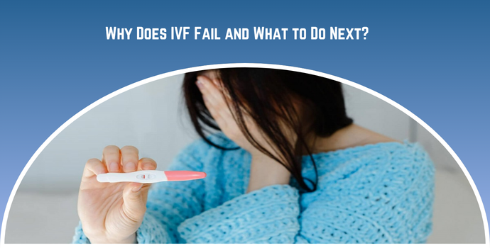 Woman in a blue sweater covers her face while holding a pregnancy test, illustrating IVF failure concerns.